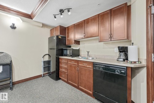 #209 1589 Glastonbury Bv Nw, Edmonton, AB - Indoor Photo Showing Kitchen With Double Sink