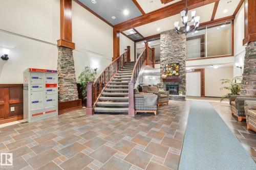 #209 1589 Glastonbury Bv Nw, Edmonton, AB - Indoor Photo Showing Other Room With Fireplace