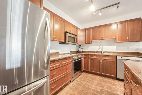 #209 1589 Glastonbury Bv Nw, Edmonton, AB - Indoor Photo Showing Kitchen With Stainless Steel Kitchen With Double Sink