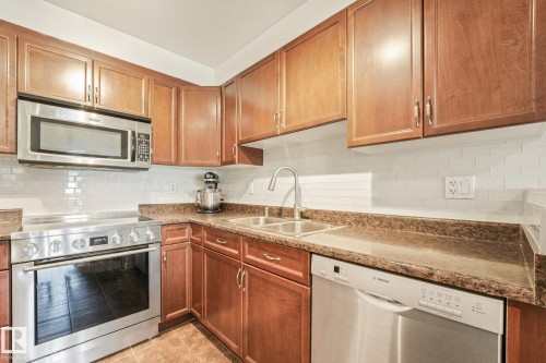 #209 1589 Glastonbury Bv Nw, Edmonton, AB - Indoor Photo Showing Kitchen With Double Sink