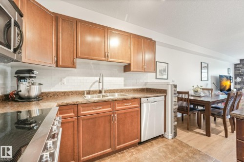 #209 1589 Glastonbury Bv Nw, Edmonton, AB - Indoor Photo Showing Kitchen With Double Sink