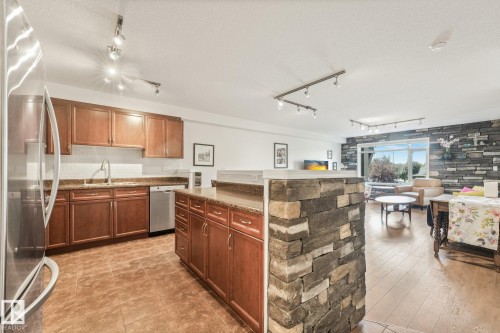#209 1589 Glastonbury Bv Nw, Edmonton, AB - Indoor Photo Showing Kitchen With Double Sink