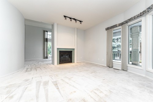 300 Ferris Way Nw, Edmonton, AB - Indoor Photo Showing Other Room With Fireplace