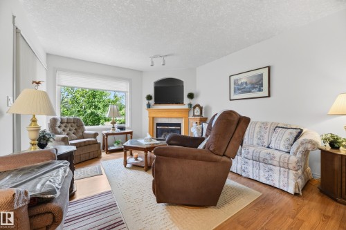 8011 164 Avenue Nw, Edmonton, AB - Indoor Photo Showing Living Room With Fireplace