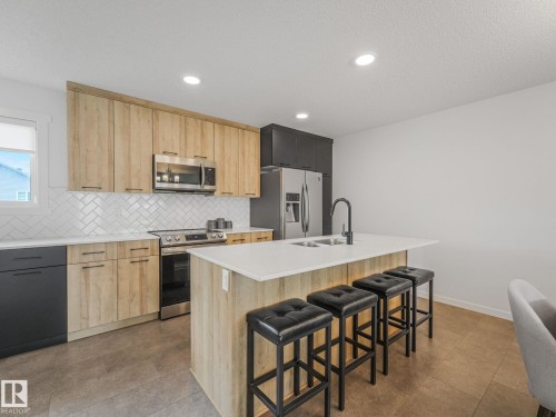 1061 Cy Becker Road Nw, Edmonton, AB - Indoor Photo Showing Kitchen With Upgraded Kitchen
