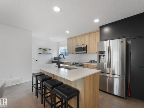 1061 Cy Becker Road Nw, Edmonton, AB - Indoor Photo Showing Kitchen With Double Sink