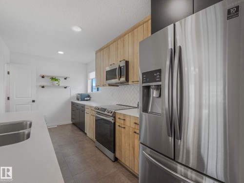 1061 Cy Becker Road Nw, Edmonton, AB - Indoor Photo Showing Kitchen With Double Sink
