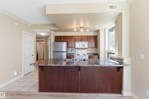 Kitchen - #708 9939 109 St Nw, Edmonton, AB - Indoor Photo Showing Kitchen With Double Sink