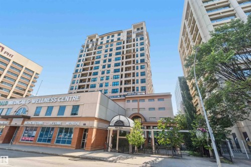 Modern high-rise residential building featuring a light-colored facade and multiple balconies - #708 9939 109 St Nw, Edmonton, AB - Outdoor With Facade