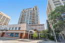 Modern high-rise residential building featuring a light-colored facade and multiple balconies - #708 9939 109 St Nw, Edmonton, AB  - Outdoor With Facade 