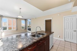 Kitchen island with dual stainless steel sinks and a chrome faucet - 