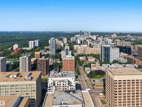 Expansive cityscape with varied architectural styles, dense urban development, and abundant surrounding green spaces - #708 9939 109 St Nw, Edmonton, AB - Outdoor With View
