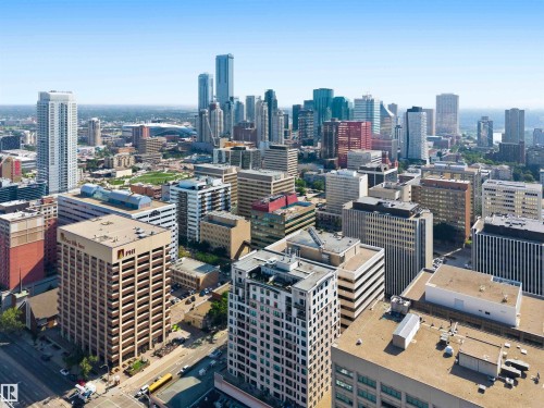 Expansive city skyline featuring a diverse collection of high-rise buildings, including contemporary glass towers and traditional brick structures - #708 9939 109 St Nw, Edmonton, AB - Outdoor With View