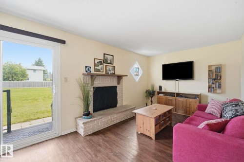 5362 38A Avenue Nw, Edmonton, AB - Indoor Photo Showing Living Room With Fireplace