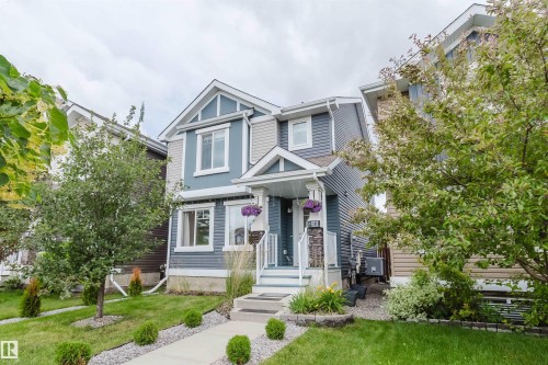 Multi-level facade featuring blue and gray siding with white trim - 6717 Elston Lane Nw, Edmonton, AB - Outdoor With Facade