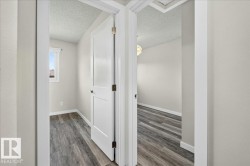 Interior doorways showcasing modern panel doors and wood-finish flooring - 