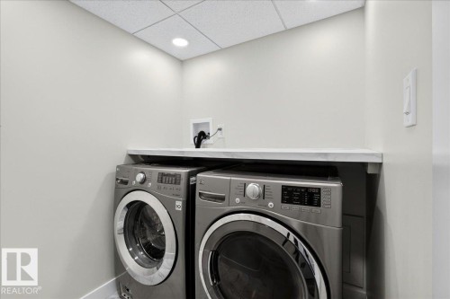 Dedicated laundry area featuring a light-toned countertop, recessed lighting, and a neutral color palette - 4212 32 Avenue Nw, Edmonton, AB - Indoor Photo Showing Laundry Room