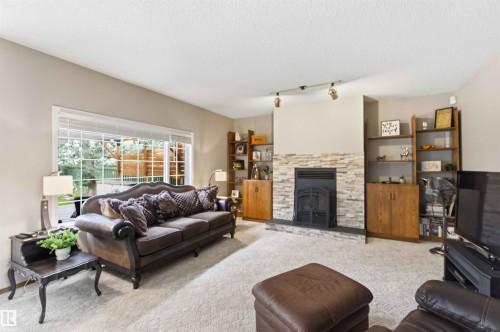 1080 Wedgewood Boulevard Nw, Edmonton, AB - Indoor Photo Showing Living Room With Fireplace
