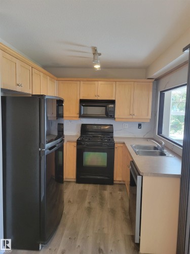 #157 230 Edwards Dr Sw, Edmonton, AB - Indoor Photo Showing Kitchen With Double Sink