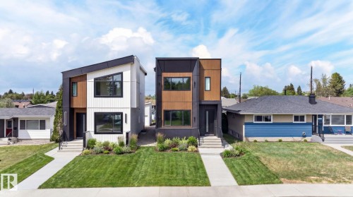 Contemporary architecture featuring a striking white and wood-finish facade - 5308 103A Avenue, Edmonton, AB - Outdoor With Facade