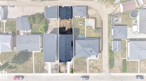 Aerial view showcasing a residential property with a dark shingle roof and a paved driveway - 5308 103A Avenue, Edmonton, AB - Other