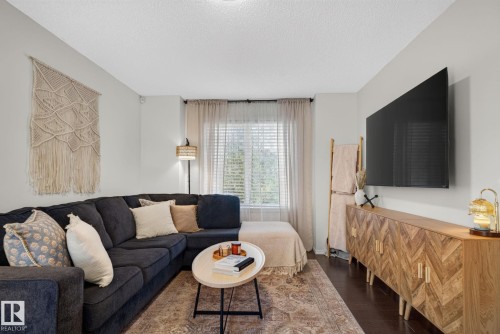 Living area featuring dark wood-finish flooring and light gray walls - 191 Brookview Place, Stony Plain, AB - Indoor Photo Showing Living Room
