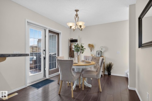 Dining area featuring dark wood-finish flooring and light neutral wall paint - 191 Brookview Place, Stony Plain, AB - Indoor Photo Showing Dining Room