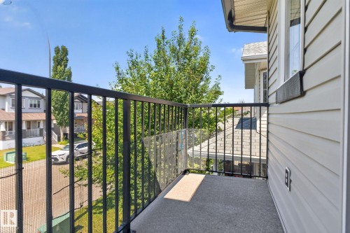 Exterior balcony featuring a concrete floor, black metal railings, and a partial clear panel - 191 Brookview Place, Stony Plain, AB - Outdoor With Exterior