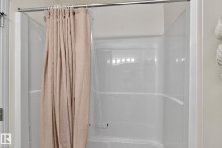 White fiberglass shower enclosure with an integrated shelf - 