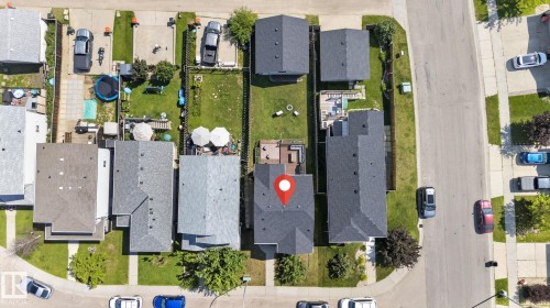 Property featuring a shingled roof, a paved driveway, and a front yard with manicured landscaping - 191 Brookview Place, Stony Plain, AB -  With View