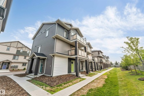 Modern townhouse exterior featuring multi-level design - #25 1530 Tamarack Bv Nw, Edmonton, AB - Outdoor With Facade