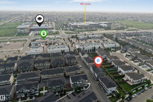 Aerial view of a residential community featuring townhomes and single-family residences - #25 1530 Tamarack Bv Nw, Edmonton, AB - Outdoor With View