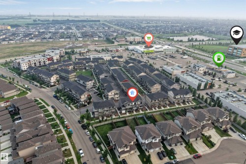 Aerial perspective showcasing a residential community with varied housing styles - #25 1530 Tamarack Bv Nw, Edmonton, AB - Outdoor With View