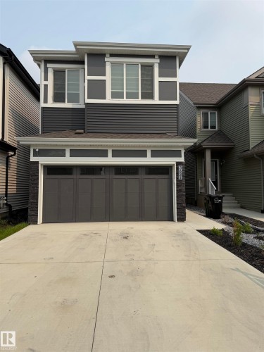 Modern two-story residence featuring dark gray siding and white trim accents - 3631 213 Street Nw, Edmonton, AB - Outdoor