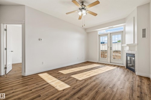 #110 5211 50 St, Stony Plain, AB - Indoor Photo Showing Other Room With Fireplace