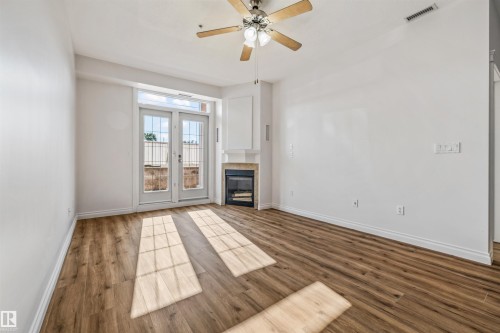 #110 5211 50 St, Stony Plain, AB - Indoor With Fireplace