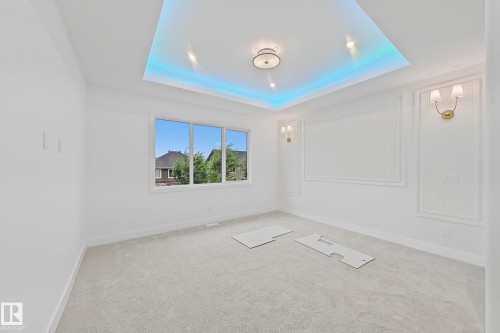 Recessed ceiling featuring perimeter lighting and a central fixture - 8423 Mayday Link Link Sw, Edmonton, AB - Indoor Photo Showing Other Room