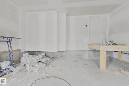 Unfinished interior space featuring white walls and a concrete floor - 8423 Mayday Link Link Sw, Edmonton, AB - Indoor