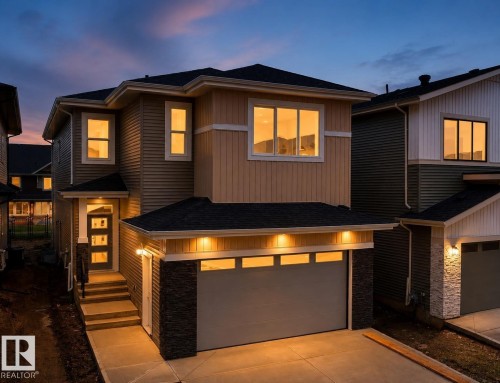 Contemporary two-story residence featuring light tan siding with white trim accents - 8423 Mayday Link Link Sw, Edmonton, AB - Outdoor With Exterior