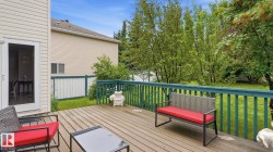 Wood-finish deck with a painted railing system - 