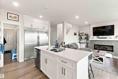 7608 Creighton Place Sw, Edmonton, AB - Indoor Photo Showing Kitchen With Fireplace With Double Sink