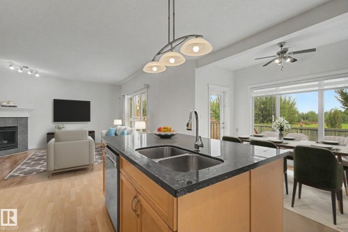 66 Vanessa Avenue, Spruce Grove, AB - Indoor Photo Showing Kitchen With Fireplace With Double Sink