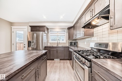 5709 66 Street, Beaumont, AB - Indoor Photo Showing Kitchen With Stainless Steel Kitchen With Double Sink With Upgraded Kitchen
