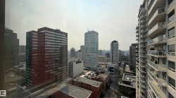 Expansive urban landscape featuring multiple high-rise buildings and city streets - 