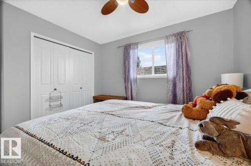 Bedroom featuring light gray walls, a window with natural light, and a ceiling fan - 6 Norfolk Close, St. Albert, AB - Indoor Photo Showing Bedroom