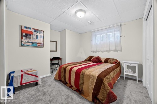 Carpeted room with a drop ceiling and recessed lighting - 6 Norfolk Close, St. Albert, AB - Indoor Photo Showing Bedroom