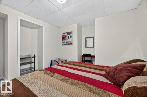 Recessed open alcove, neutral wall color, recessed ceiling lighting, and clean white trim work - 6 Norfolk Close, St. Albert, AB - Indoor Photo Showing Bedroom