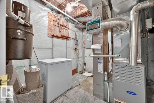 Carrier brand furnace system with attached ductwork and ventilation - 6 Norfolk Close, St. Albert, AB - Indoor Photo Showing Basement