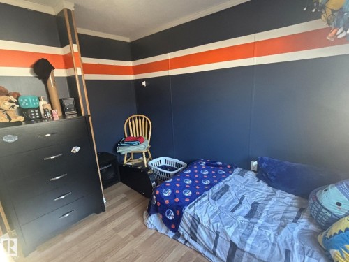Nicely painted with Oiler colors! - 20 Sunset Boulevard, Spruce Grove, AB - Indoor Photo Showing Bedroom