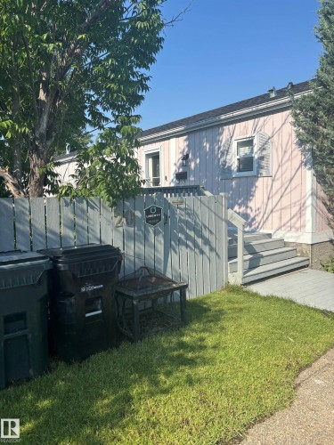 Two paved parking spaces leading to the main entry and gate to the yard - 20 Sunset Boulevard, Spruce Grove, AB - Outdoor